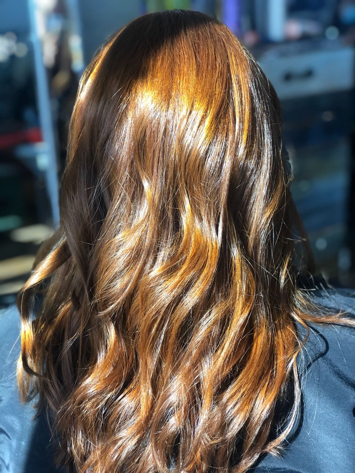 Copper highlights on dark brunette